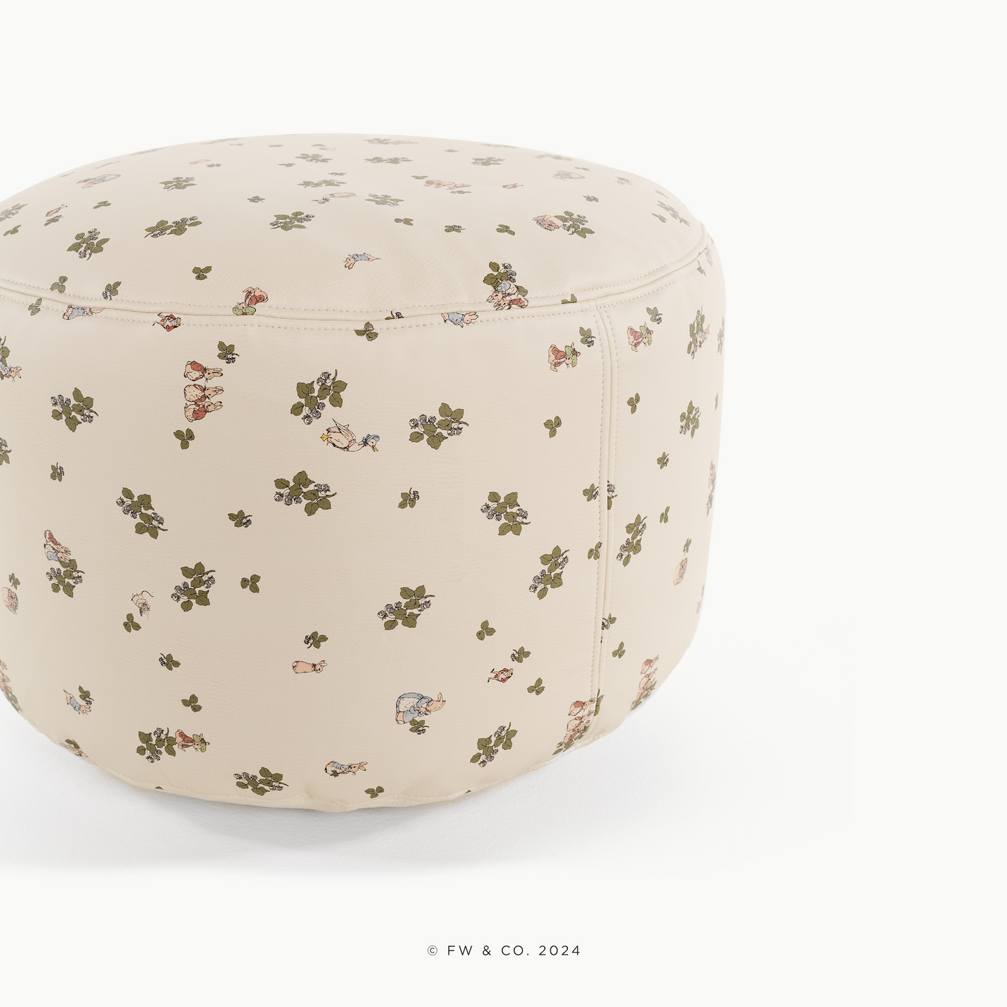 Round ottoman with floral pattern on a white background