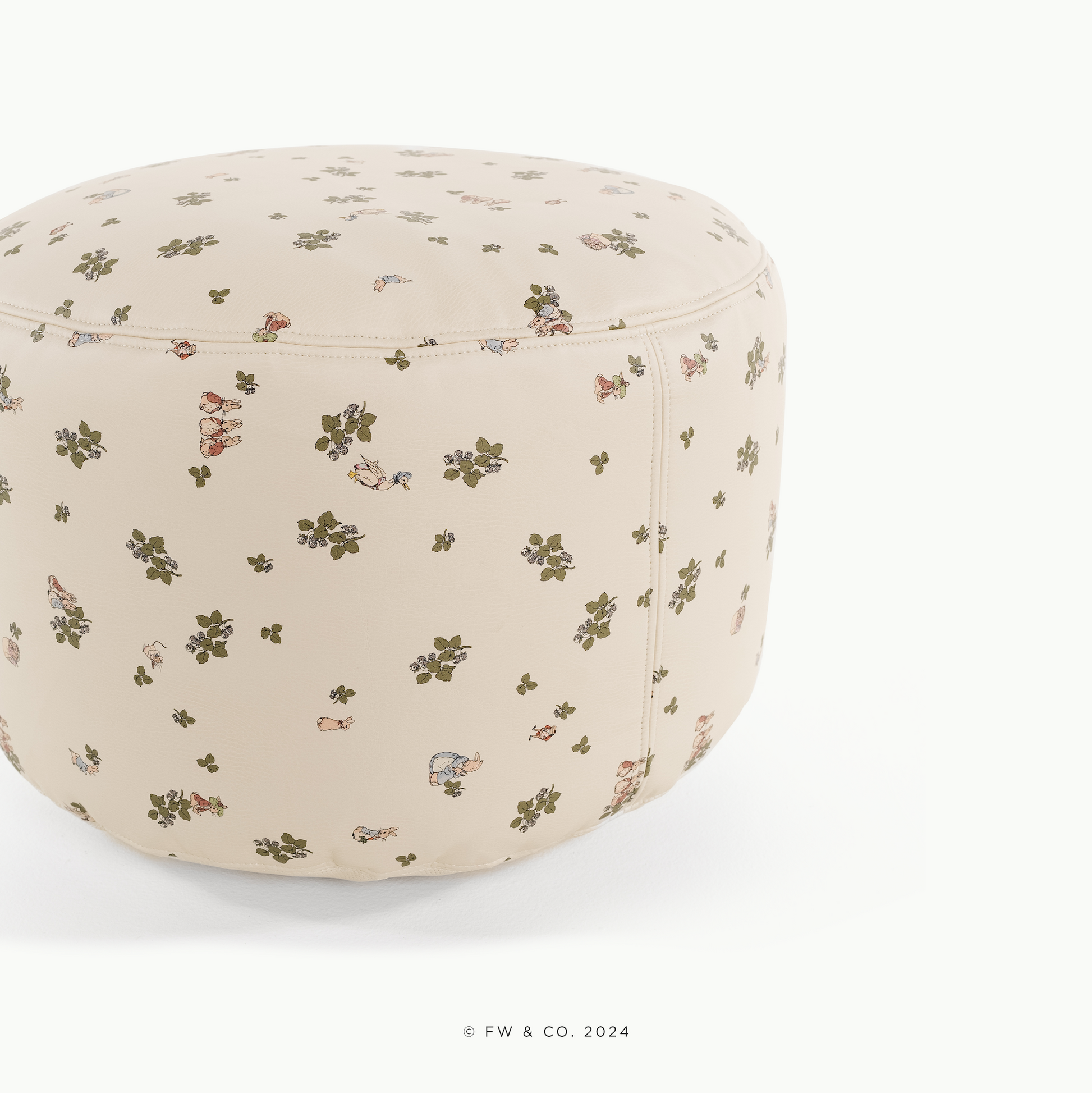 Round ottoman with floral pattern on a white background