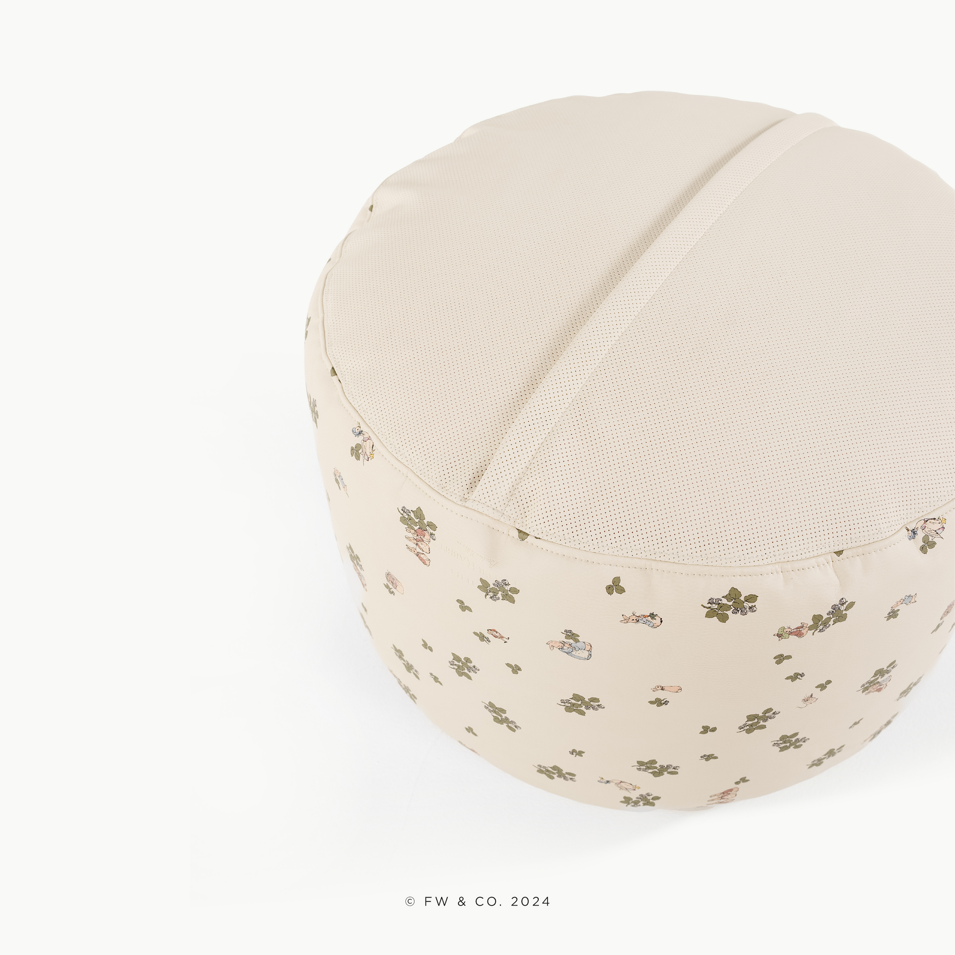 Round beige cushion with floral pattern on a white background